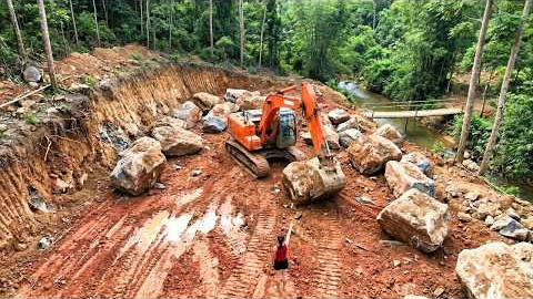 High Power Excavator Breaking Massive Rocks, Building A New House On A Steep Mountainside