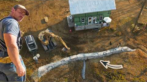 HE FINALLY FINISHED IT!       Roughcut limestone retaining wall build at our off grid home